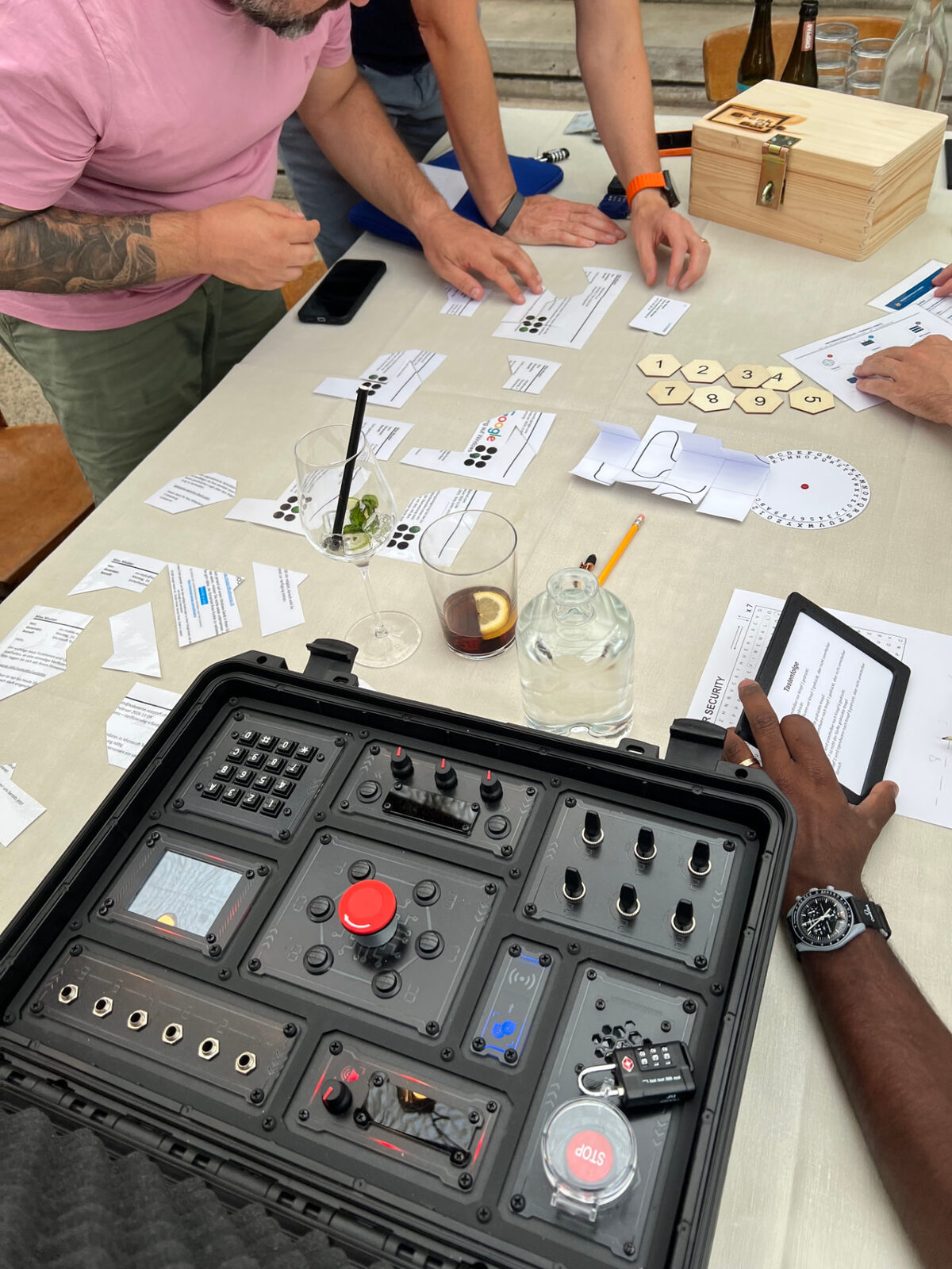 Mobile escape case with game materials on a table