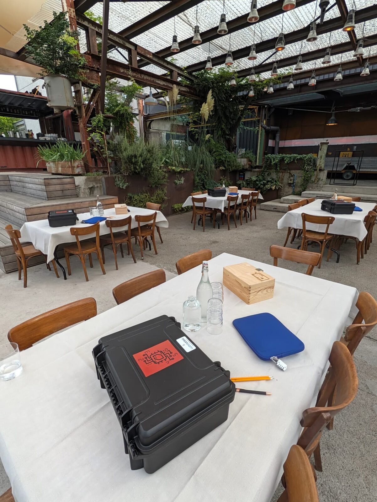 Event hall with prepared tables for mobile escape game