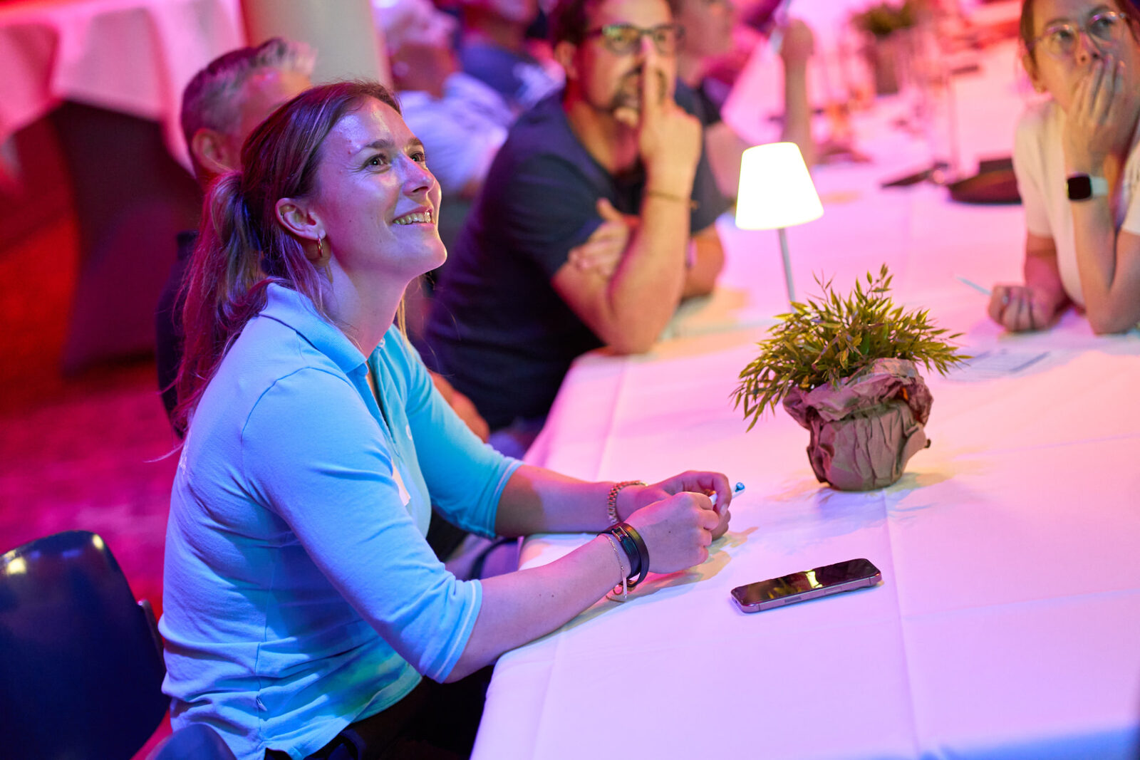 Guests laughing while following the quiz